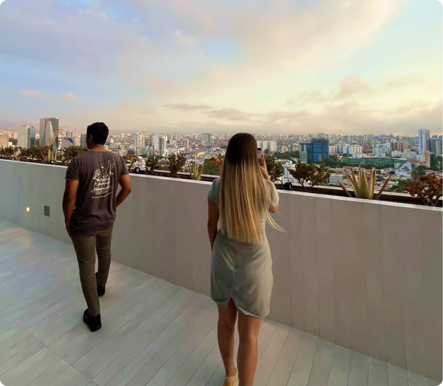 Property 1=side-view-couple-talking-real-estate-agent 1